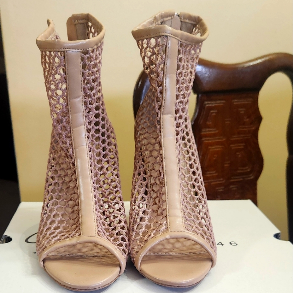 Open toe heels with back zipper.